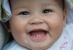 Signs of Baby's First Tooth Emergence and How to Deal With It